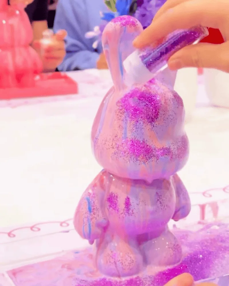 Colourful acrylic pouring at a children's drip art party